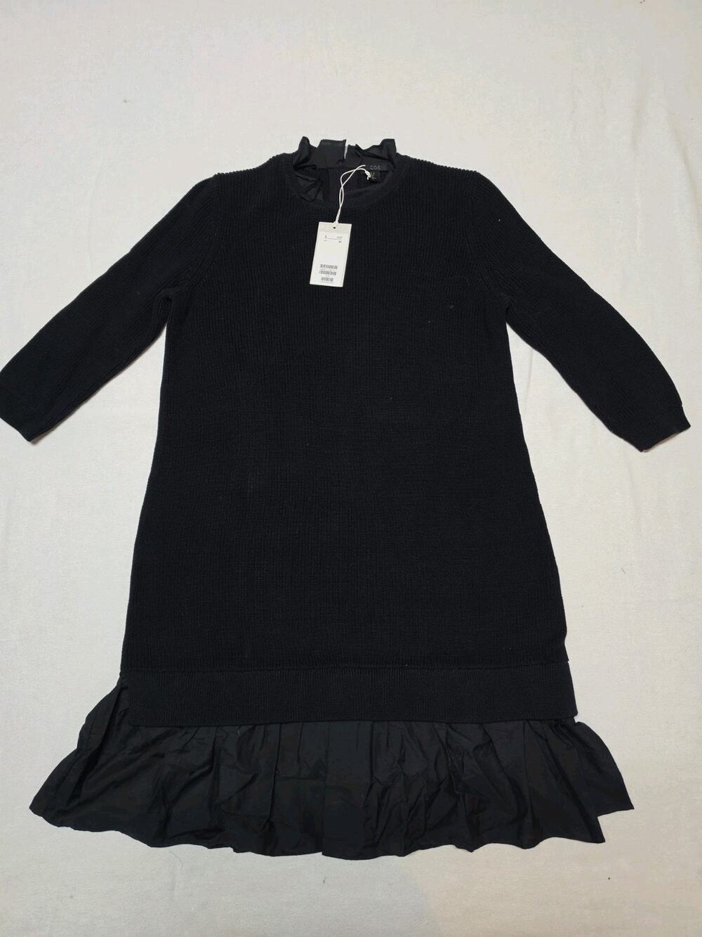 Cos dark blue knit sweater dress with a ruffled fabric hem and a partial zip...